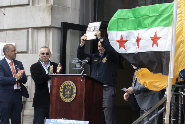 04-20-19 SOUTH PATERSON PROJECT/SYRIAN ANNIVERSARY : Paterson mayor Andre Sayegh is honored with a plaque at the Syrian Independence flag raising ceremony at Paterson City Hall. Sayegh is of Lebanese and Syrian descent.Evacuation Day is Syria's national day commemorating the evacuation of the last French soldier and Syria's proclamation of full independence and the end of the French mandate of Syria on April 17,1946, and does not correlate to the current political strife in Syria, This ceremony did NOT recognize the flag used by the Syrian Government, instead honored the flag used by the Syrian Opposition.


-photo by Thomas E. Franklin
*PERMISSION GRANTED TO ROUND EARTH MEDIA