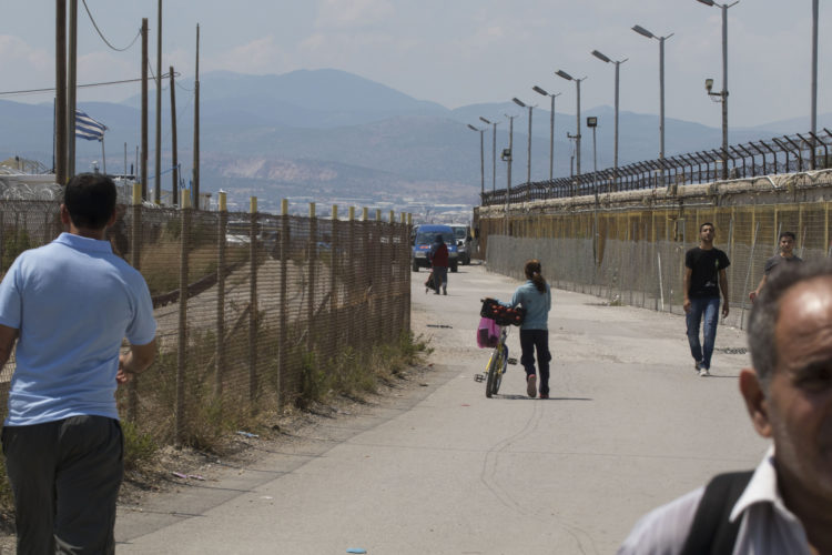 06/01/2017 ATHENS, GREECE (EU) Refugees are free to leave the Skaramagas refugee camp, located 11k west of Athens, where it has become home to 3,000 refugees mostly from Syria, Iraq and Afghanistan, have been settled here to wait out the sometimes years-long relocation process elsewhere in Europe. They live in trailer-like homes 3,200 refugees wait out the sometimes years-long relocation process in caravans, trailer-like homes lined up in rows leading to a common area with a community center, a playground, and offices for non-governmental organizations (NGOs).