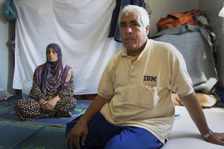 LESVOS, GREECE  06/05/2017: Abdul Kaoud, a Syrian refugee who fled war-torn Syria over a year ago with his family, sits in his trailer at the Kara Tepe refugee camp in Levsos, which houses roughly 1,200 asylum seekers in tightly packed rows of shipping containers converted into family dwellings. Asylum seekers here face many challenges such as inadequate access to electricity and water, restrictions on employment and educational opportunities, lack of targeted mental health interventions for youth, and poor access to legal advice. However, the non-profit Movement on the Ground, has made efforts to build a more self-sufficient community-like atmosphere, and has worked to improve conditions here.