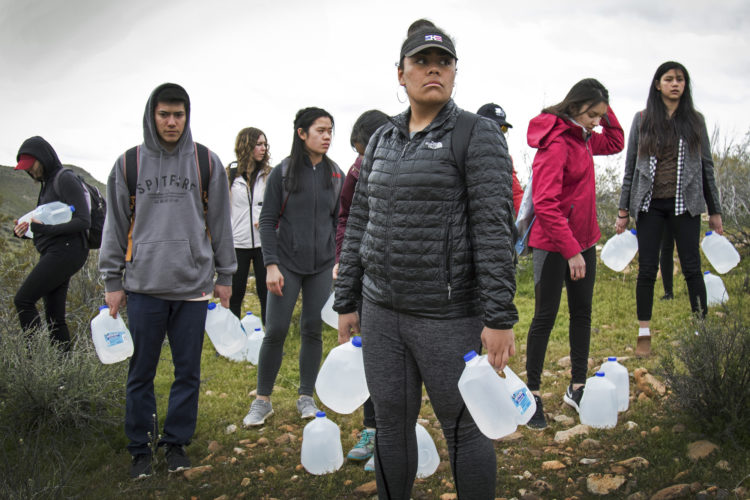 IMPERIAL COUNTY, CA 03/10/2019:  Joy Kavapalu and other students from University of Utah load up with water bottles as they joined a Border Angels on a  “water drop” in the desert for migrants.