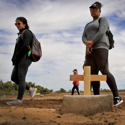 HOLTVILLE, CA 03/10/2019:  A group of students from the University of Utah visit the “Cemetery of the Forgotten” where the remains of hundreds of unidentified immigrants are buried in a dirt lot behind the Terrace Park Cemetery in Holtville, CA. The unidentified migrants died in the Imperial Valley desert or mountains are buried in anonymity, an extreme reflection of the often desperate attempts by people to enter the U.S. where the flow of unauthorized immigrants has been a source of debate for decades. The students, who were volunteering for the Border Angels organization, fixed crosses that had fallen over, took photos, and said a group prayer with Border Angels' Hugo Castro.