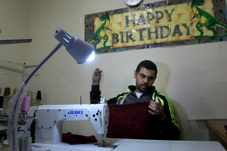ELIZABETH, NJ   04/03/2016   SYRIAN REFUGEE FAMILIES RESETTLED IN ELIZABETH:  Mohammed Zakkour works at his new sewing machine in the family's apartment in Elizabeth where the IRC resettled them. The Bnai Keshet Synagogue in Montclair raised money to buy the swing machine so Zakkour, who was a tailor back in Syria, would have a way to generate income. The Zakkour's fled their home in Homs, Syria, after it became unsafe due to aerial bombings, They fled to Jordan where they were remained for 4-years before being resettled in Elizabeth by the IRC.