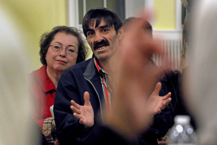 ELIZABETH, NJ   03/24/2016   SYRIAN REFUGEE MEETING:  Syrian refugee Fadel El Radi, speaks with the aid of an Arabic translator, tells members of the International Rescue Committee (IRC) about problems the children are having adjusting to the Elizabeth schools, as well as other issues the refugee families having while struggling to adjust to their new lives in the U.S.