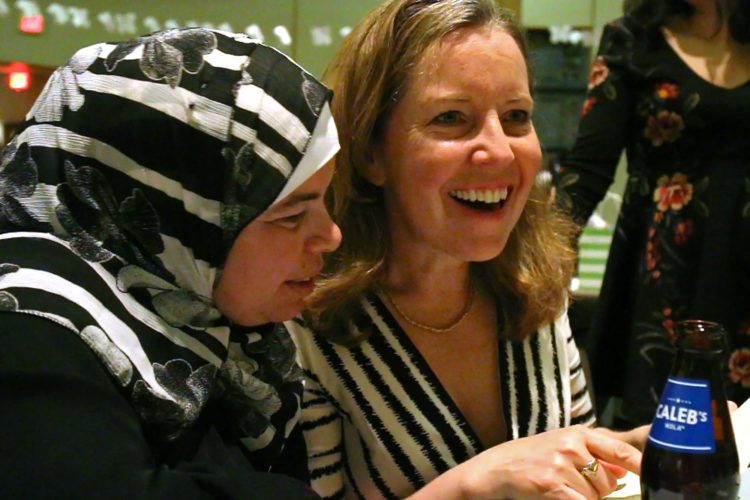 MONTCLAIR, NJ   04/23/2016   SYRIAN REFUGEE FAMILIES RESETTLED IN ELIZABETH/ COMMUNITY SEDER:  Kate McCaffrey of the Bnai Keshet Synagogue, attempts some Arabic phrases with Maryam Al Radi. The two have become very close in the few months they have known each other, despite cultural and language differences. The Bnai Keshet congregation invited the Al Radi family, who are Muslim, to their community Seder for Passover.