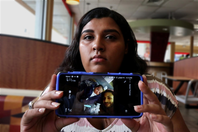 NEWARK, NJ  07-17-2018: NEWARK, NJ  07-17-2018  IMMIGRATION PROJECT: Kasandra Serrano, 21, shows a photo of her fiancé Daniel Castro, 28, and their young child Ismael. Danny was taken into custody by Newark Police in June 2018 and turned over to ICE despite Newark's Sanctuary City policy. Castro, who is undocumented but has no criminal record and did not commit any offense the evening of his arrest, was falsely arrested, and Newark Police admit they made a mistake in violating the city's own Sanctuary City policy. On the night of his arrest, Castro was returning from shopping for baby formula when he was stopped by police and reluctantly gave his name when they arrested him for an outstanding ICE warrant from many years ago for which he said he was never notified. After many months of being held at the Elizabeth Detention Center (ICE) he was deported to his native Nicaragua where he currently awaiting a status hearing in New Jersey. The couple has a 9-month old baby boy, Ismael, and since Danny's arrest Serrano has been living with her mother, sisters, and their young children in a small apartment in Newark, and says she cannot support herself and the baby without government and family assistance.