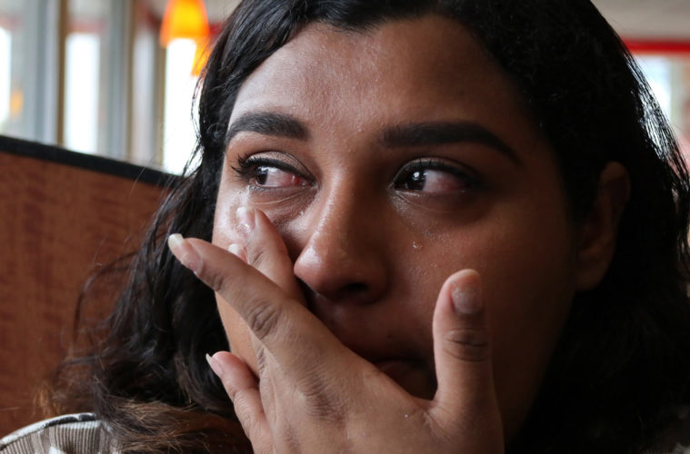 NEWARK, NJ  07-17-2018  IMMIGRATION PROJECT: Kasandra Serrano, 21, wipes away tears of concern for her fiancé Daniel Castro, 28, who was taken into custody by Newark Police in June 2018 and turned over to ICE. Castro, who is undocumented but has no criminal record and did not commit any offense the evening of his arrest, was falsely arrested, and Newark Police admit they made a mistake in violating the city's own Sanctuary City policy. Castro was returning from shopping for baby formula, and reluctantly he gave police his name when they arrested him for an outstanding ICE warrant from many years ago for which he said he was never notified. After many months of being held at the Elizabeth Detention Center (ICE) he was deported to his native Nicaragua where he currently awaiting a status hearing in New Jersey. The couple has a 9-month old baby boy, Ismael, and since Danny's arrest Serrano has been living with her mother, sisters, and their young children in a small apartment in Newark, and says she cannot support herself and the baby without government and family assistance.