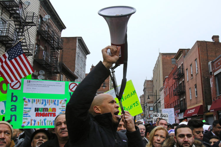 PATERSON, NY  02/05/2017: Senator Cory Booker uses a megaphone to rally protesters during the “March for Peace and Decency” in downtown Paterson. The crowd of roughly 2,000 included scores of religious leaders, elected officials, activists, and local families who  marched through downtown before gathering at the Great Falls National Park. Senator Robert Menendez and Congressman Bill Pascrell, Jr. also joined the march. Rally organizers said they hoped to unite Christian, Jewish, Muslim, and other religious leaders, “in a peaceful manner to demand justice for all.”