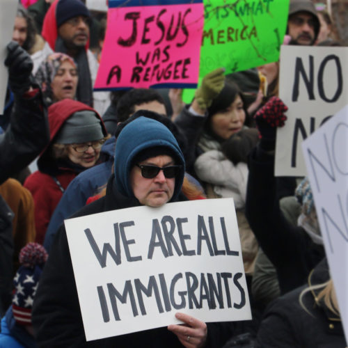 PATERSON, NY  02/05/2017: A protester carries a sign during the “March for Peace and Decency” in downtown Paterson. The crowd of roughly 2,000 included scores of religious leaders, elected officials, activists, and local families who  marched through downtown before gathering at the Great Falls National Park. Senators Cory Booker and Robert Menendez, and Congressman Bill Pascrell, Jr. also joined the march. Rally organizers said they hoped to unite Christian, Jewish, Muslim, and other religious leaders, “in a peaceful manner to demand justice for all.”