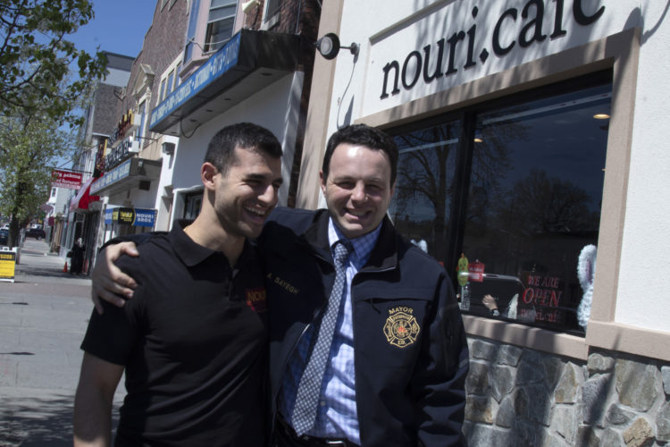 04-17-19PATERSON, NJ: Andre Sayegh, the mayor of Paterson, NJ, hugs George Noury (note his name and the restaurant name are spelled differently) who runs the Nouri.Cafe on Main Street in South Paterson. Sayegh is the first Arab-American to lead the city, which has had a long-thriving Middle Eastern immigrant community in the southern district of the city known as South Paterson. Sayegh’s was born to a Syrian mother and a Lebanese father, and is Christian, was a longtime city councilman and was elected mayor in 2018.
